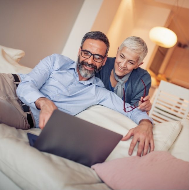 Two people looking at laptop