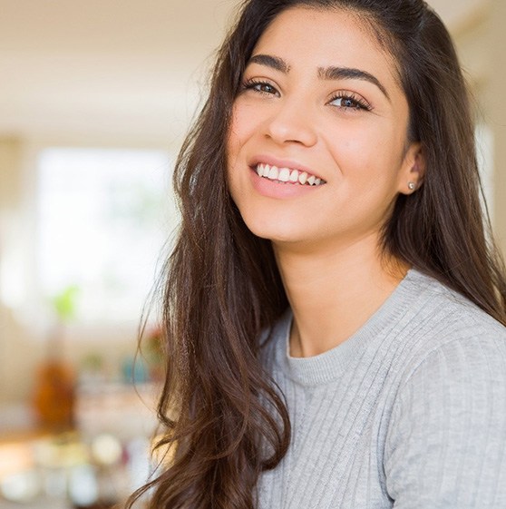 A young woman smiling