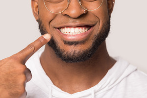 Man with a bright white smile after KOR teeth whitening